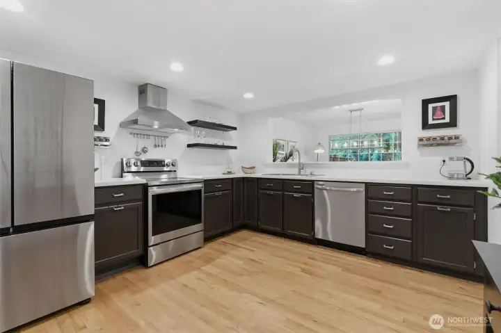 Kitchen with updated appliances and quartz countertops