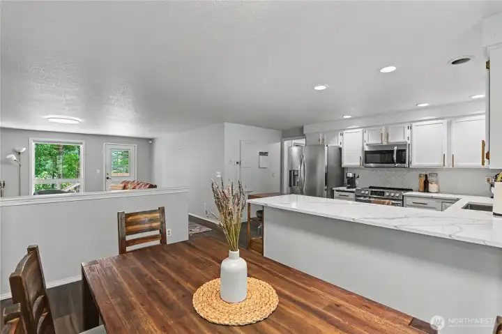 1/2 wall creates nice separation from dining to living space.