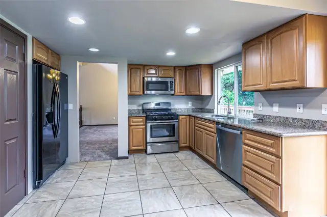 Kitchen features stainless steel appliances and granite counters