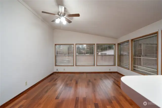 Family room with vaulted ceilings and lots of windows.