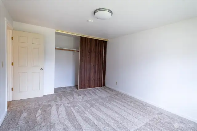 Large closet and crawlspace access in second bedroom