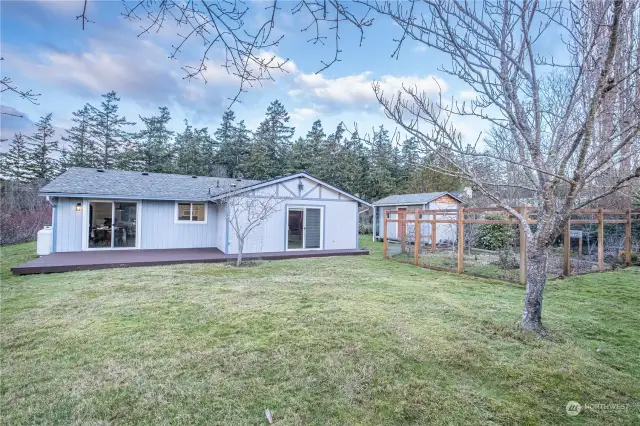 Rear view of property and deck