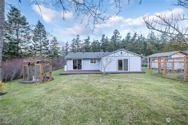 Rear view of home and garden