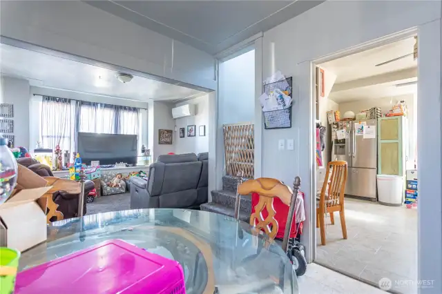 From dining space into kitchen and living room. Stairs up to 2 large bedrooms