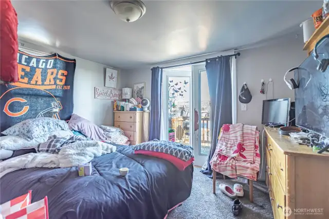 Main floor primary suite with deck. Enjoy views over the city and looking East