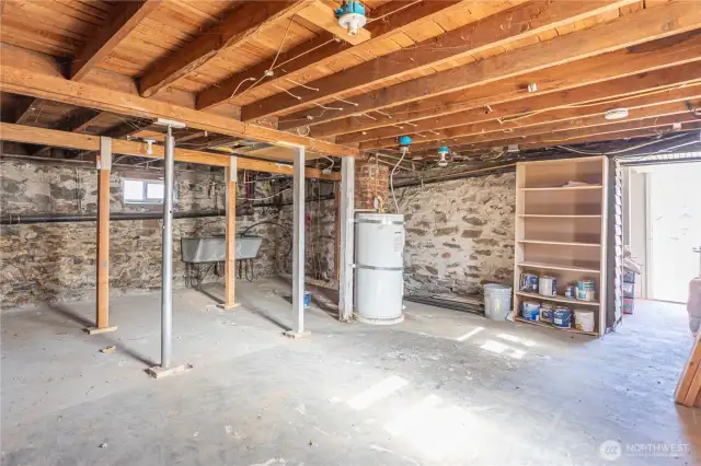 Unfinished side of basement - nice and dry, great storage or workshop space