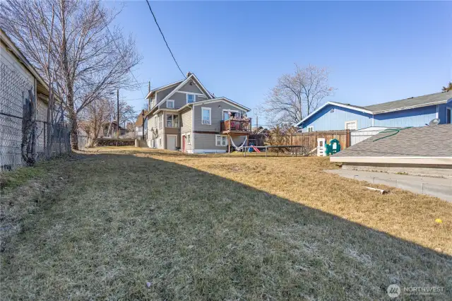 Large and fully fenced yard with new in-ground sprinkler system