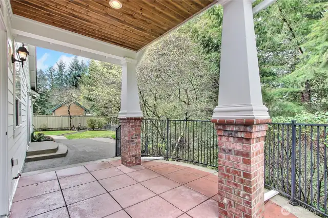 View of your patios out of the huge kitchen/dining room patio doors. Real sanctuary back here, so private and plenty of birds singing for you.
