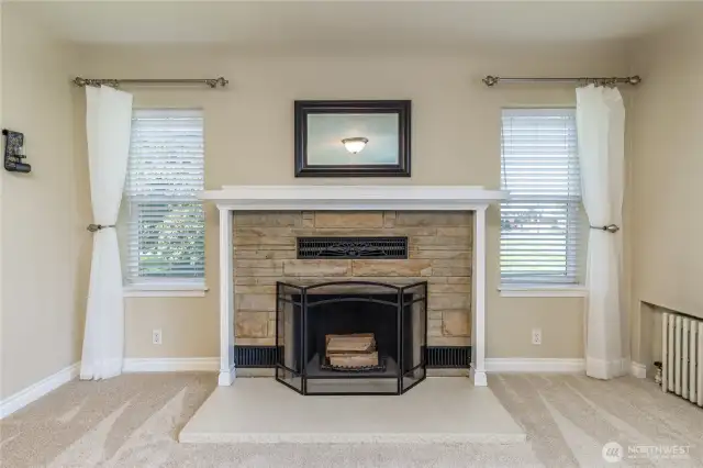 Classy wood-burning fireplace with original brickwork and metal grills
