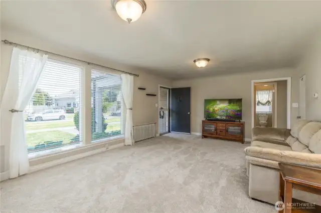 Living room has huge windows for great natural light