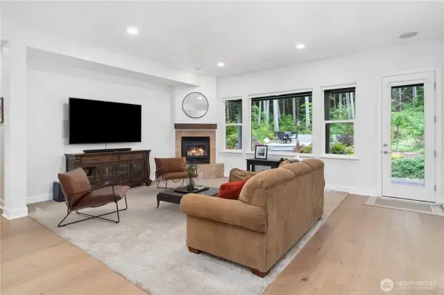 This spacious living area looks out to the beautiful natural setting. Brand new Levelor Up-Down window coverings give you privacy plus light, just as you wish.