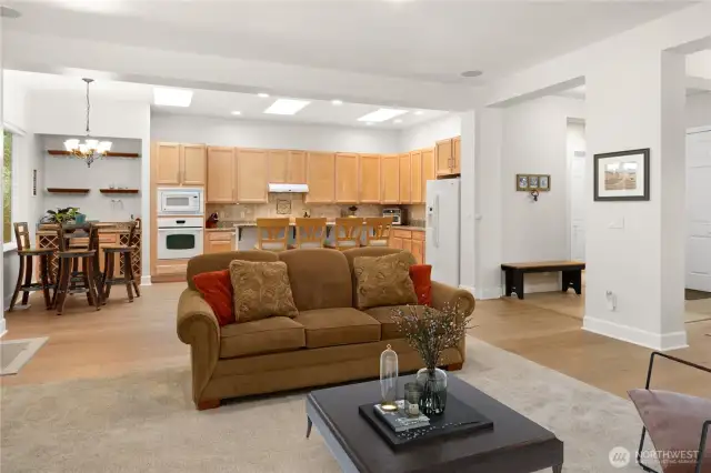 Notice the details of design in these rooms...three new kitchen skylights bring in the light, the built-in bar area has wine racks and shelving, the newer floors are scratch and water resistant, the tall ceilings add space and light.