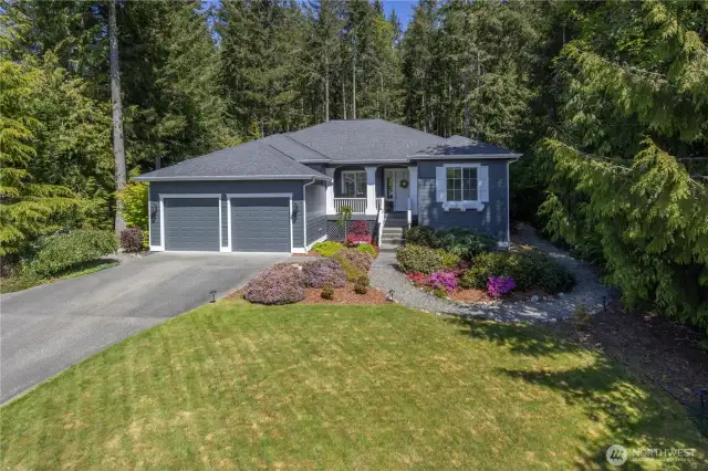A new 50-year roof and gorgeous fresh exterior paint, plus beautiful landscaping = great curb appeal! The long driveway allows for plenty of parking, too.
