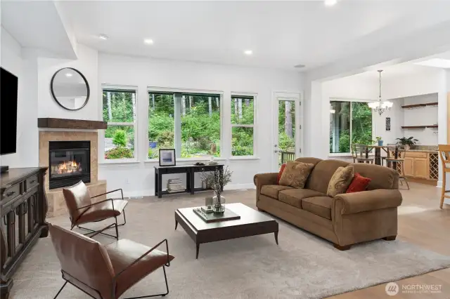 The main living space lives smartly with tall ceilings, an open concept and beautiful windows that bring the outdoors inside.