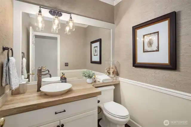 Main floor powder room was updated in 2017 and has designer touches and materials throughout. You will feel the elegance throughout the home in each and every room.