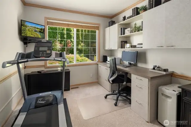 Enjoy the idyllic views to the tranquil backyard while working from home in your main floor office. Built in cabinets and desk are perfect for extra storage space.