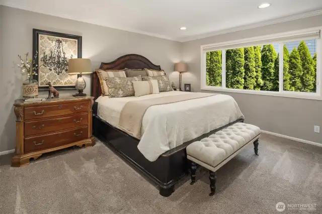 Primary bedroom is so spacious and calming. Warm, muted colors bring a sense of calm to your own sanctuary.