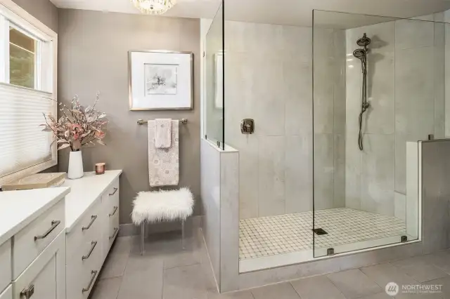 Massive double headed shower with seating area is perfect for your morning showers.