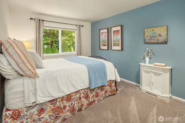 Second guest bedroom is warm and inviting. Custom Hunter Douglas blinds throughout the home. No expense spared!