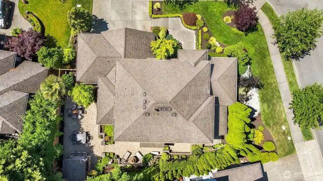 Aerial view of property shows the lush landscaping and the meticulous care that owners have taken with the property. 50 year presidential roof.