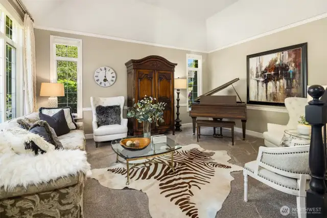 Formal living room is to the left as you enter the home. Vaulted ceilings and extra windows bring extra space and light.