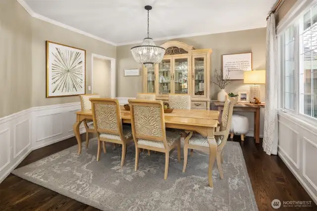 Formal dining room is large and perfect for entertaining. Wainscotting that surrounds the room completes the sense of elegance.