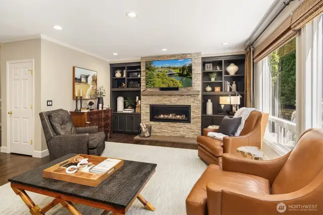 Family room has built in speakers and Elderado stacked stone fireplace and custom mantle. Custom blinds as well!