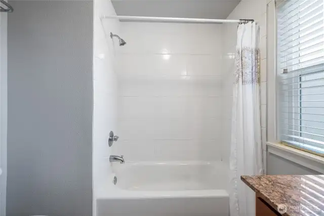 Recently refreshed, tile tub surround.