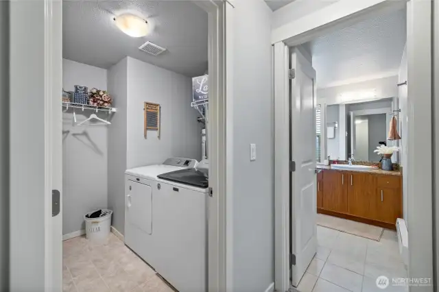 Laundry room & bath conveniently located next to one another.