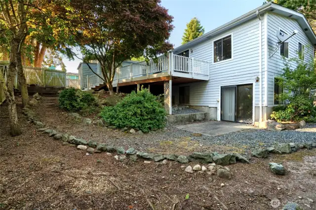 Backyard with plenty of garden space and fruit trees