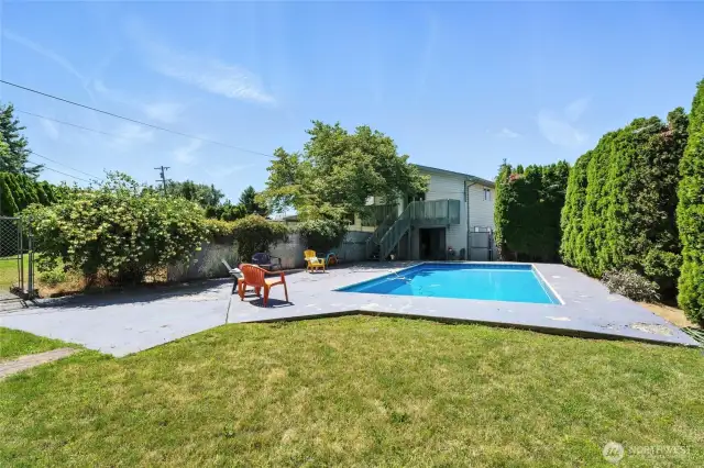 In-Ground Pool with Private Mature Trees. Pool is Fenced Off from Backyard.