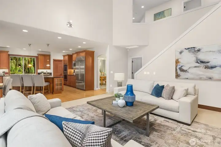 Vaulted ceilings, skylights, second staircase to upstairs, open to kitchen, and wired for surround sound.