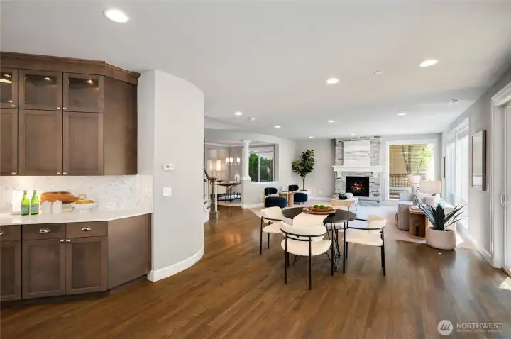 Curved designed walls elevate the elegant spaces and additional counter space and cabinetry.