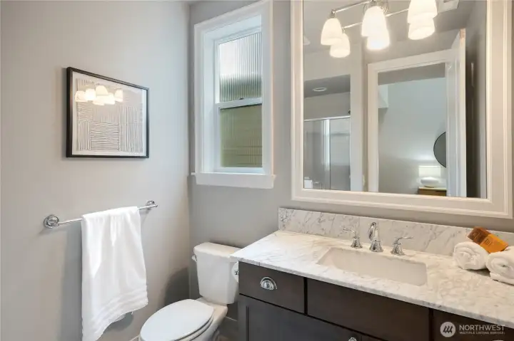 3/4 bathroom with shower on main level.