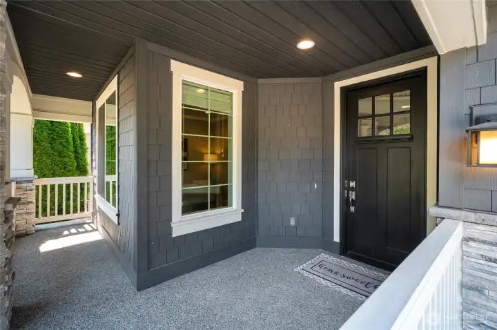 Inviting, spacious covered porch for morning coffee or reading.