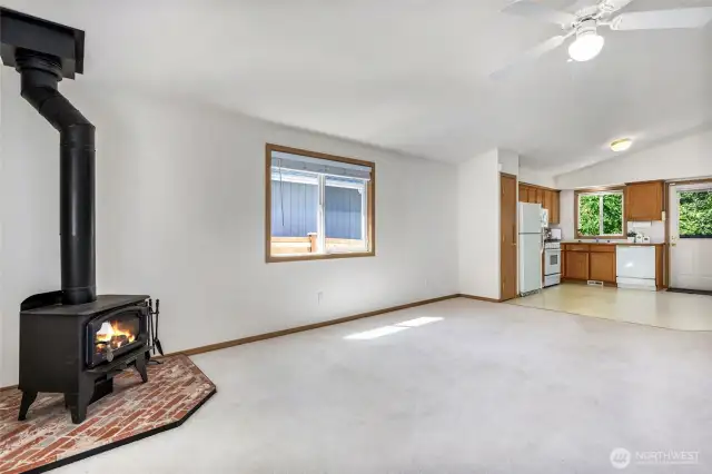 Open Living room leading to Kitchen.