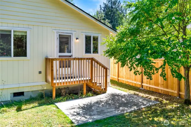 Quaint patio to relax and enjoy the peace of the private backyard