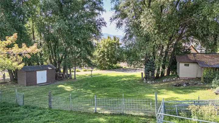 side yard w outbuildings