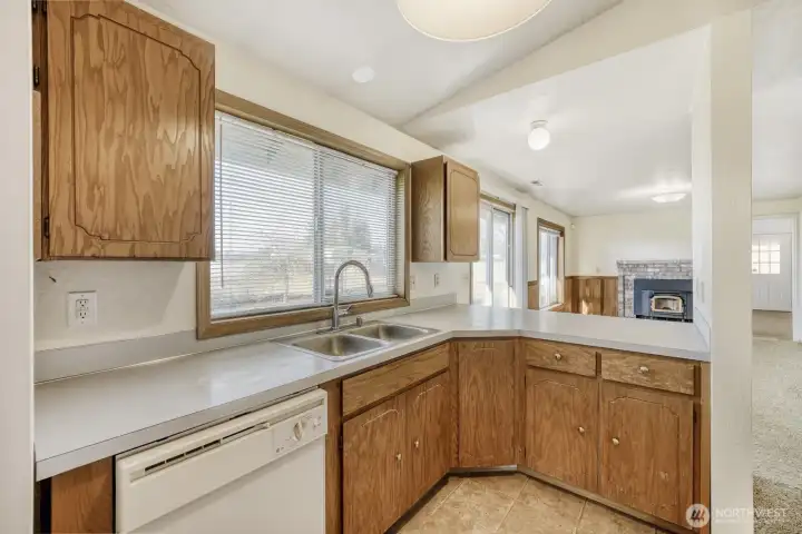 From the kitchen you can stay involved with what's going on in the  family room.