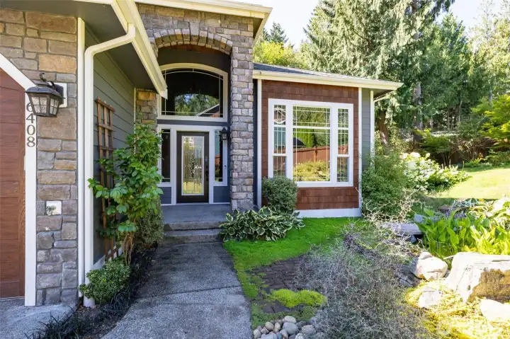 Front walkway with smaller koi pond to the right