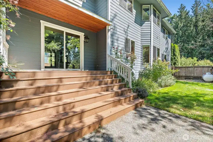 Stately steps to backyard with small deck off the dining room