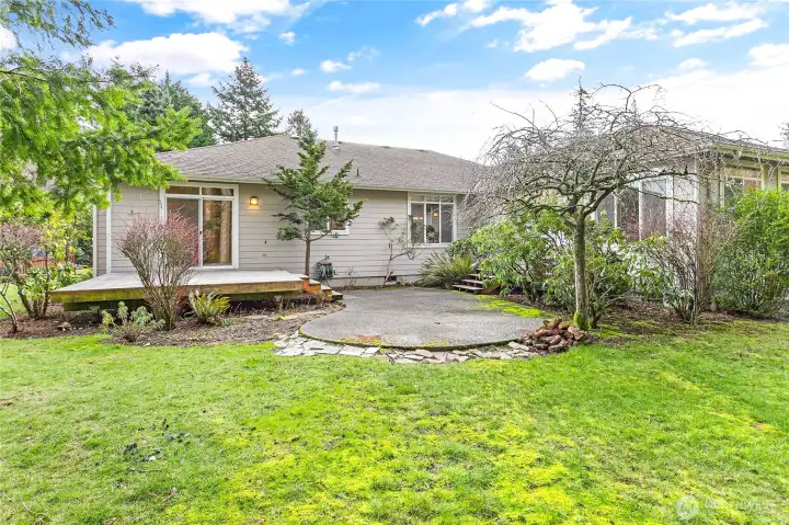 Nice backyard that backs up to the trees with mature landscaping.