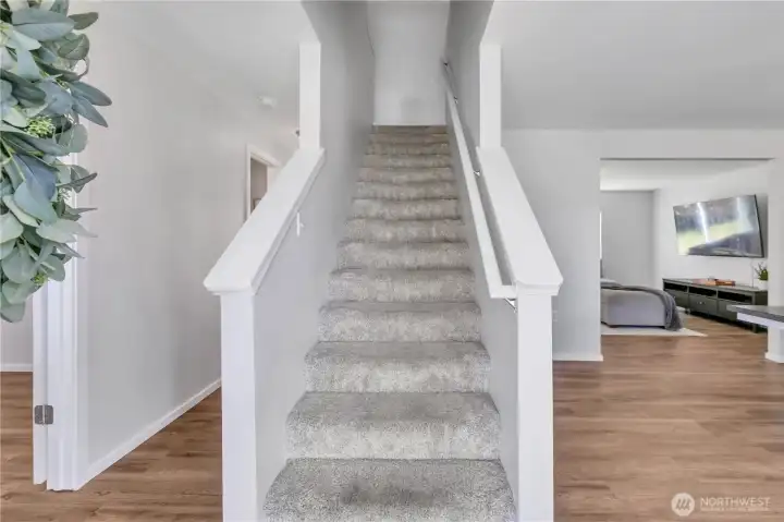 front entry to the left is a bonus room, to the right is the large family room.