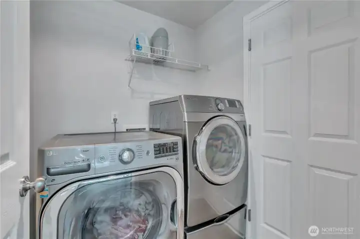 utility room that also leads to a 2 car garage.