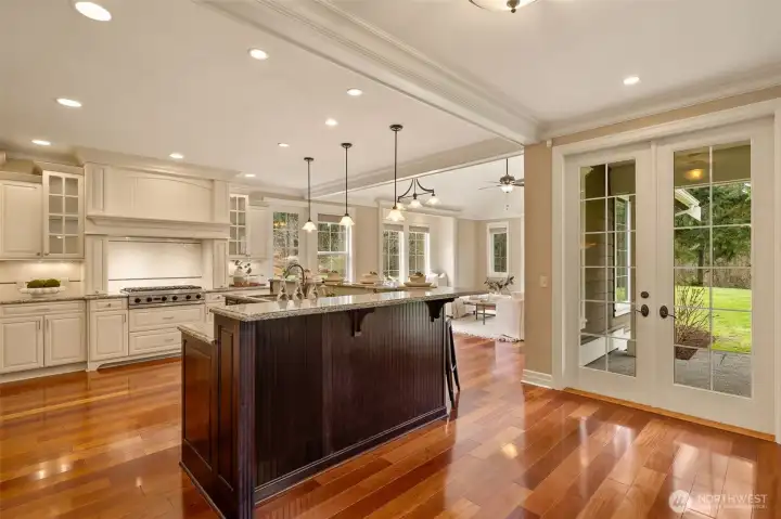 French doors to the back patio and a view of the family room.