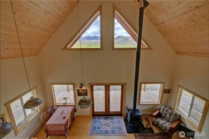 Looking down into great room from loft above.  Natual wood finishes for homey feel.