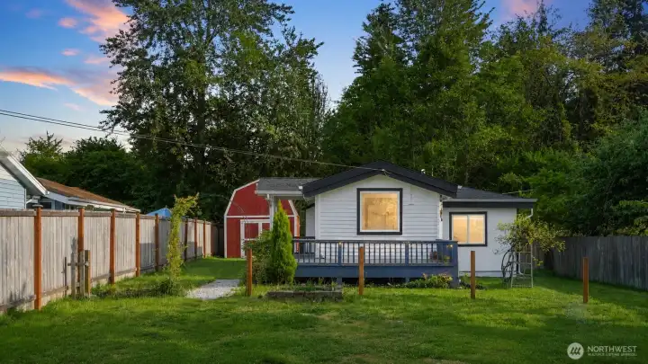 This sunny, expansive backyard is a true highlight of the property. Featuring a large, newly finished deck with stylish gray railing — perfect for BBQs, relaxing with morning coffee, or enjoying evening sunsets. The spacious, level lawn offers plenty of room for play, gardening, or future outdoor enjoyment.