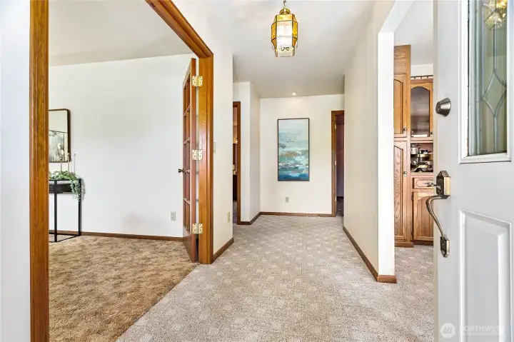 Great main floor plan with huge living room through french doors to left, formal dining with built-ins on right