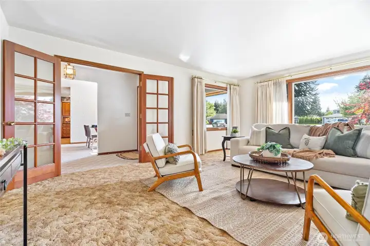 Just imagine, new flooring and this room is instantly updated! Beautiful huge Anderson windows encase the front of this spacious living room