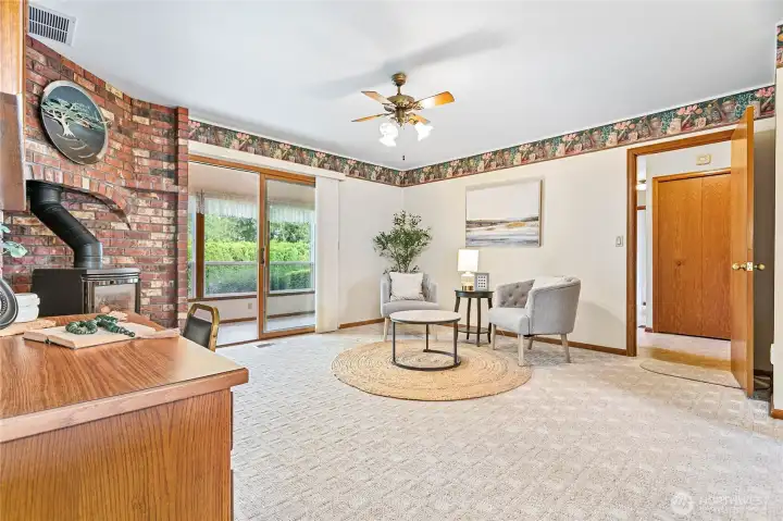 To complete the layout of this well-planned main floor, this hearth/family room behind kitchen enjoys a cozy gas fireplace
